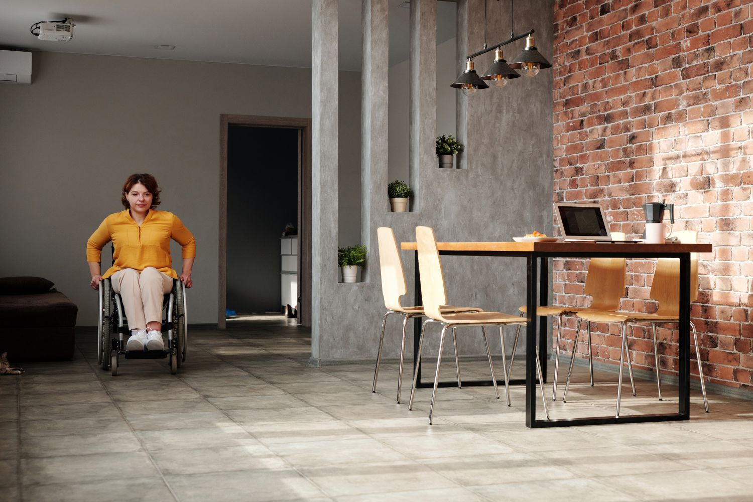 A wheelchair user moving independently through a modern home